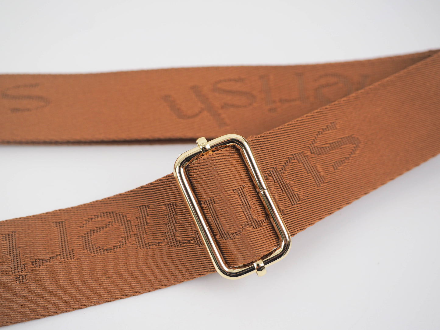 Tan water bottle bag strap