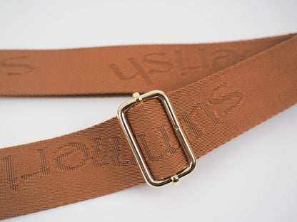 Tan water bottle bag strap